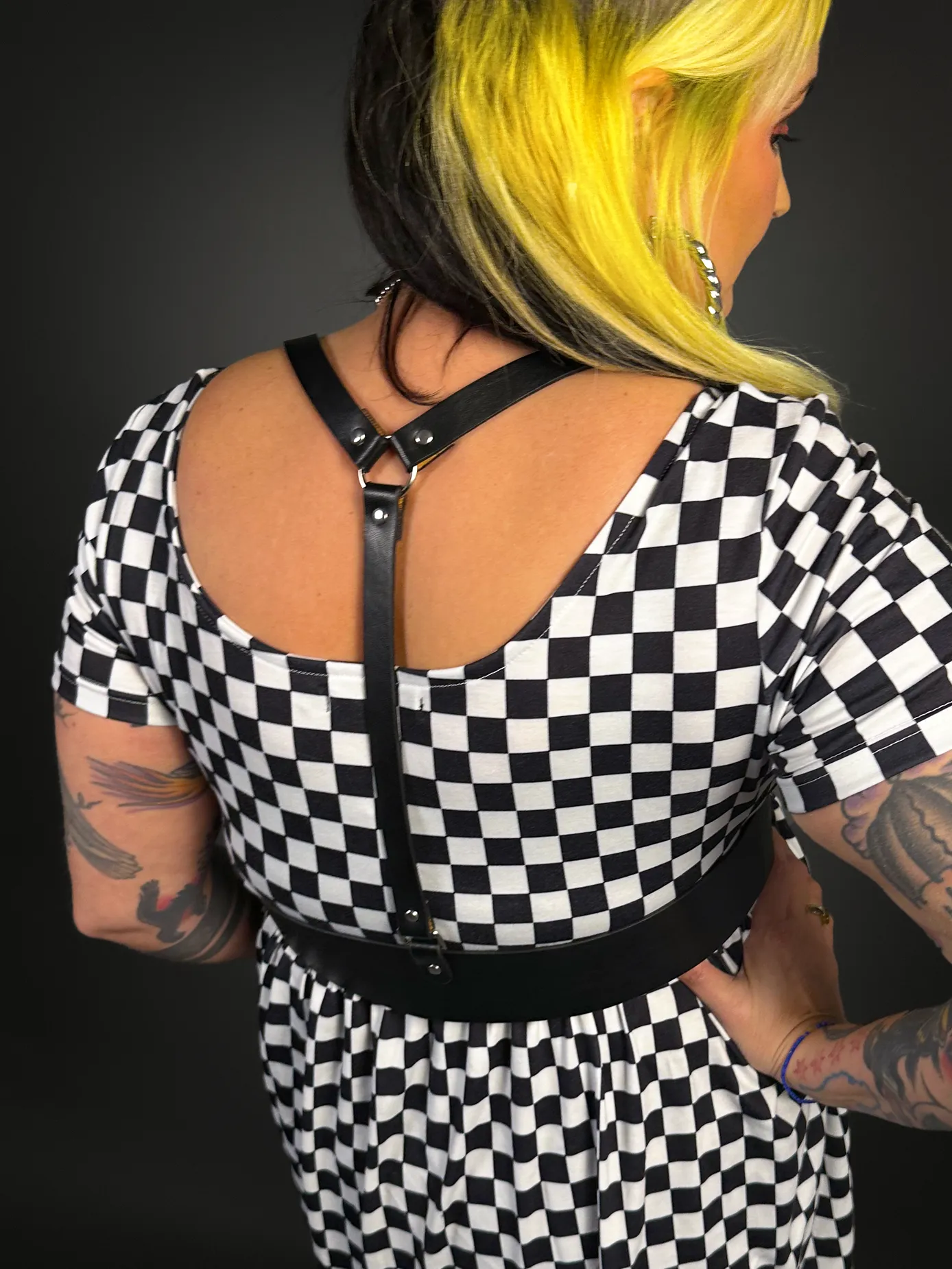Stylish Checkered Skater Dress with Classic Black Shoulder Harness Belt